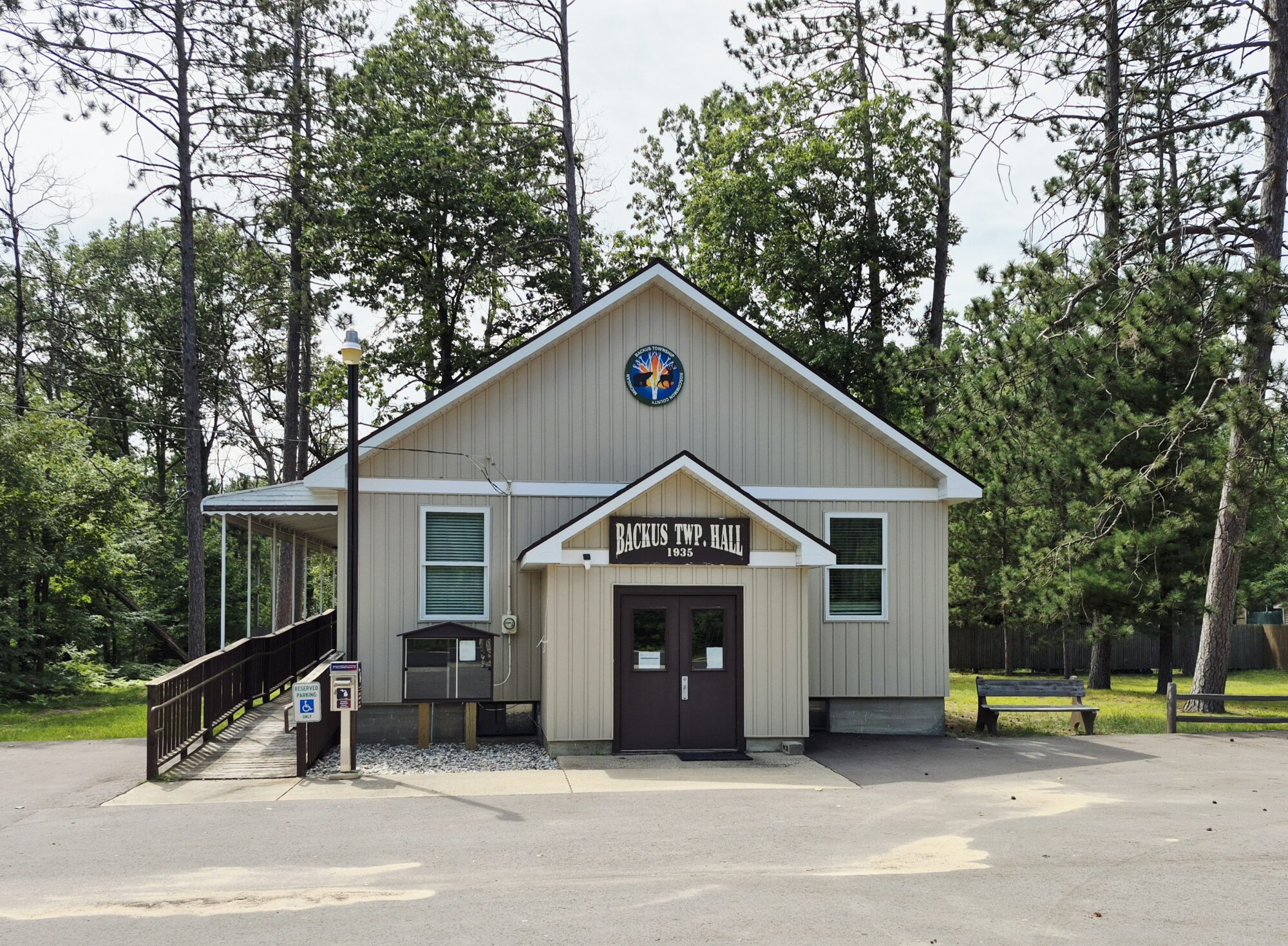 Backus Township Hall exterior in wooded area